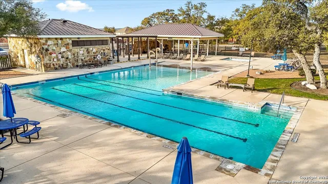 a view of a swimming pool with a lounge chairs