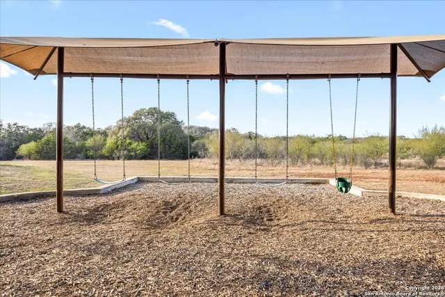 a view of a backyard of the house