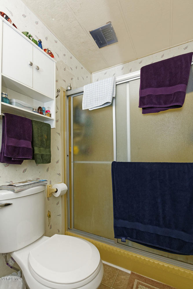 6480 Katherine Road, Unit 5 Simi Valley, CA 93063 - Photo 23 of 32 a bathroom with a toilet and a shower