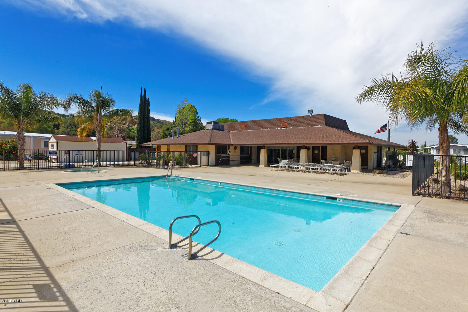 6480 Katherine Road, Unit 5 Simi Valley, CA 93063 - Photo 30 of 32 a swimming pool with outdoor seating and yard
