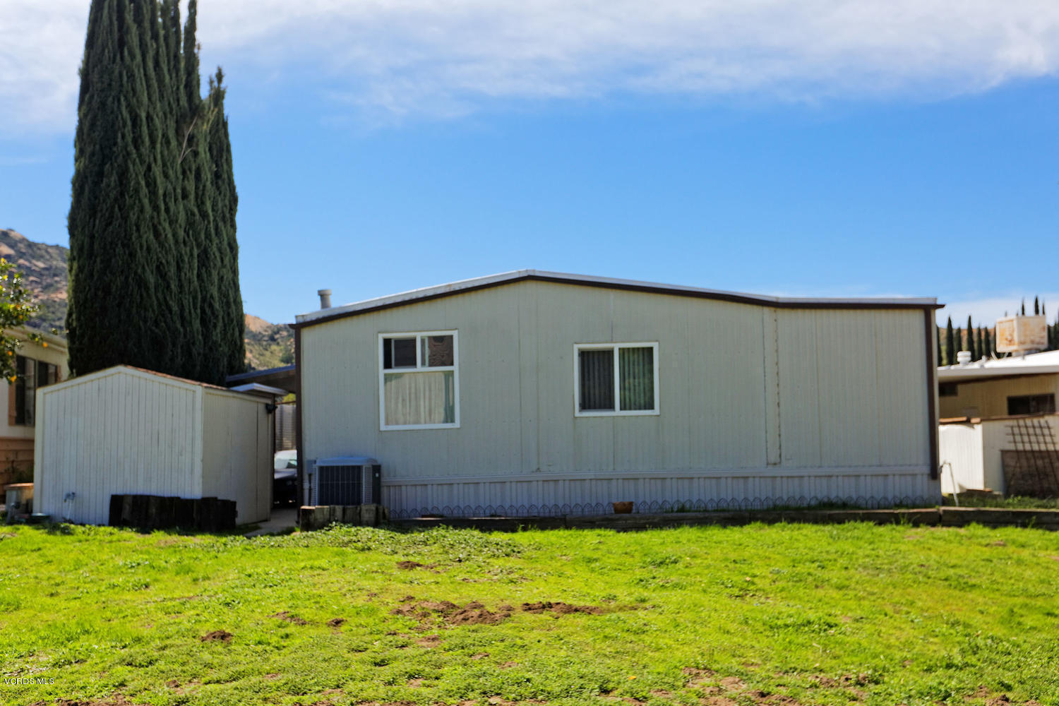 6480 Katherine Road, Unit 5 Simi Valley, CA 93063 - Photo 6 of 32 a backyard of a house with wooden fence