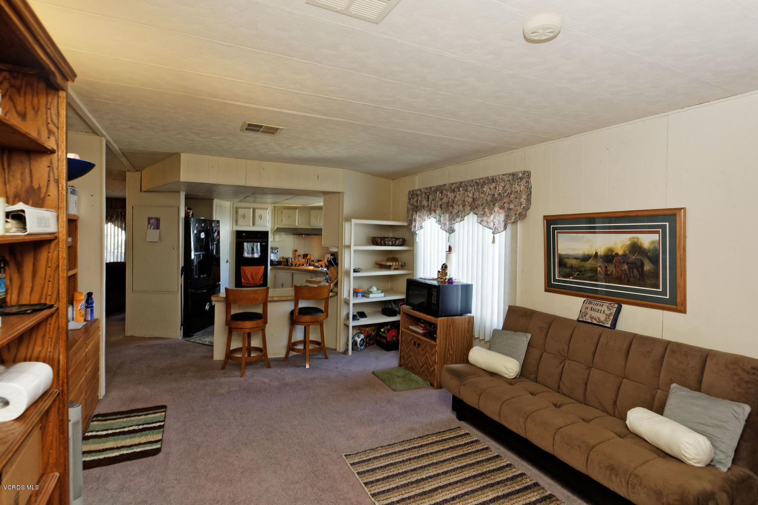 6480 Katherine Road, Unit 5 Simi Valley, CA 93063 - Photo 9 of 32 a living room with furniture a air conditioner vent and a window
