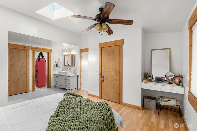 a bed room with a bed and a desk