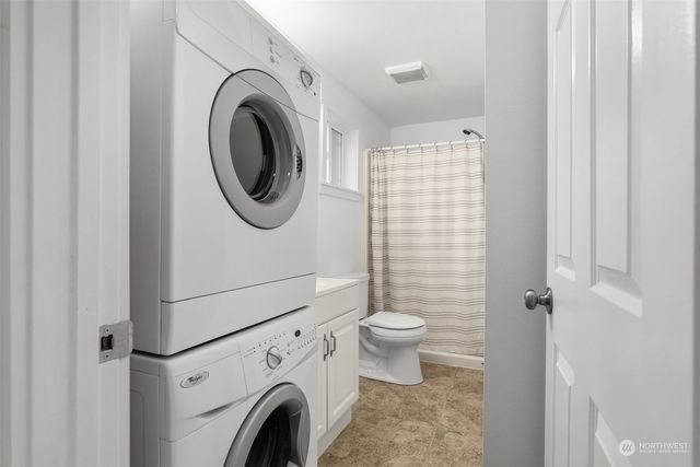 a bathroom with a sink a toilet and a shower