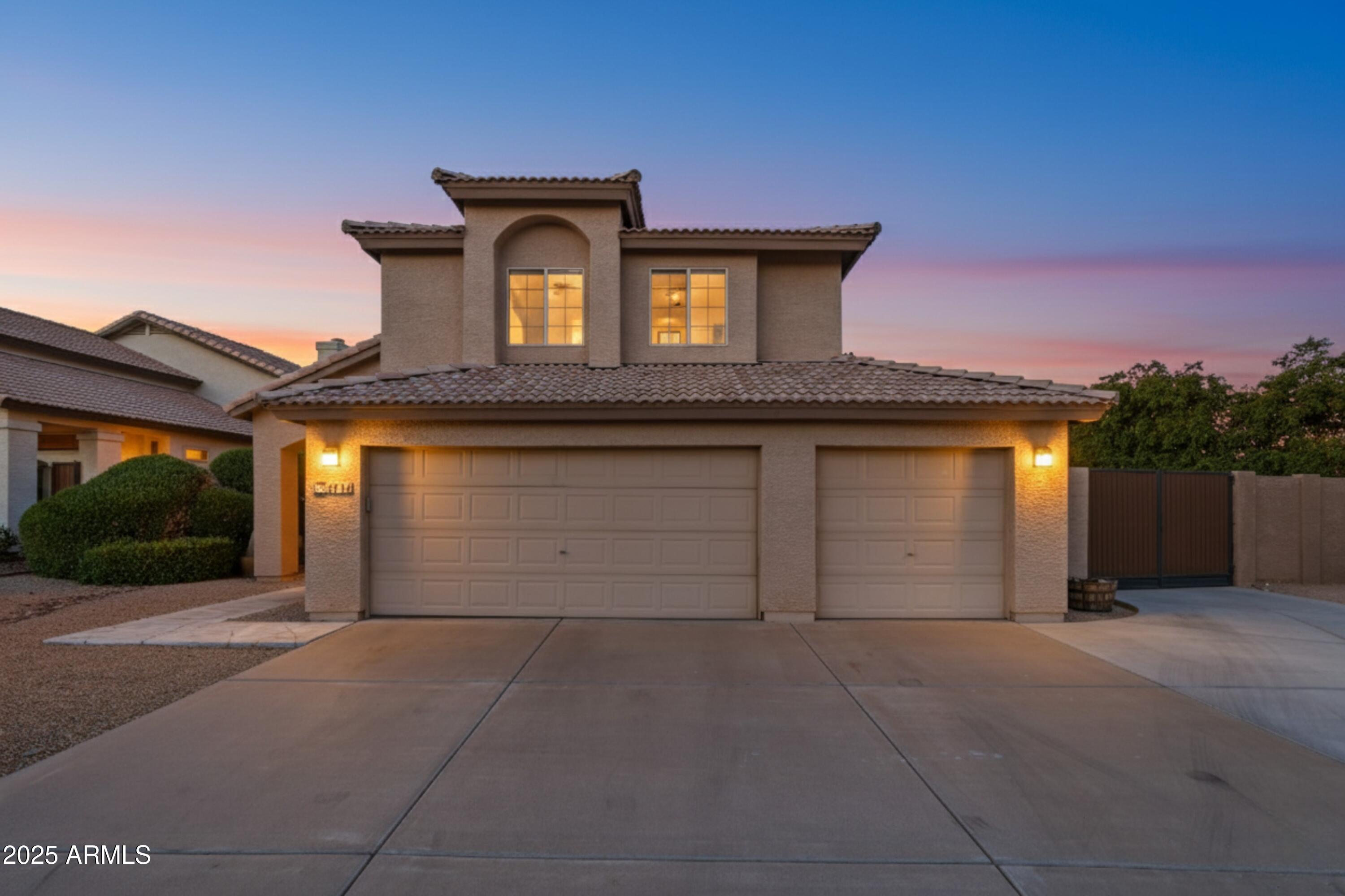 a front view of a house with a garage