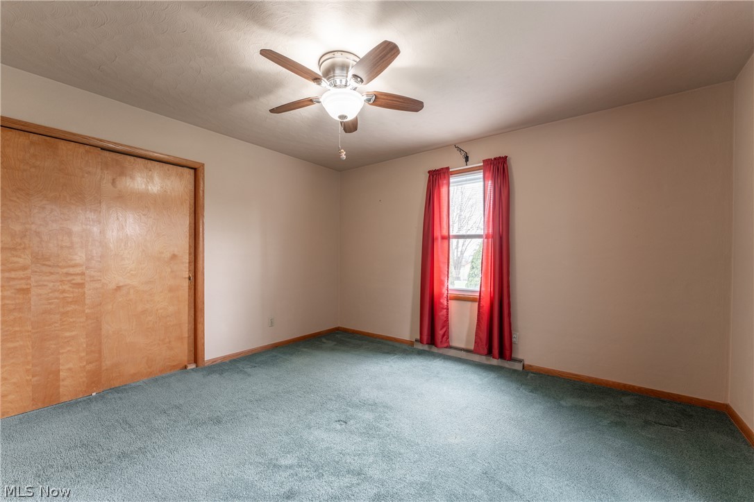 4833 Angling Road Wooster, OH 44691 - Photo 22 of 49 Empty room featuring dark colored carpet and ceiling fan