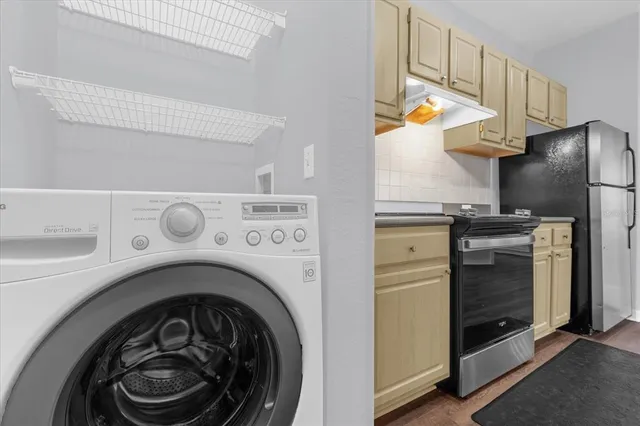 a utility room with dryer and washer