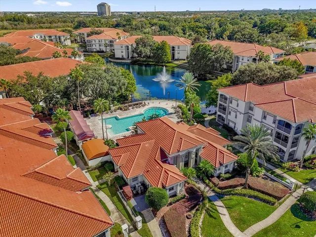 an aerial view of house with yard swimming pool and outdoor seating