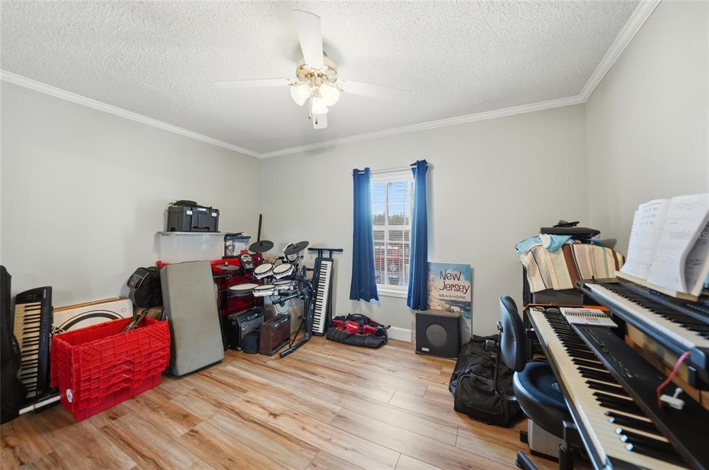 10303 Burnt Store Road, Unit 143 Punta Gorda, FL 33950 - Photo 18 of 42 a view of a workspace with furniture and gym equipment