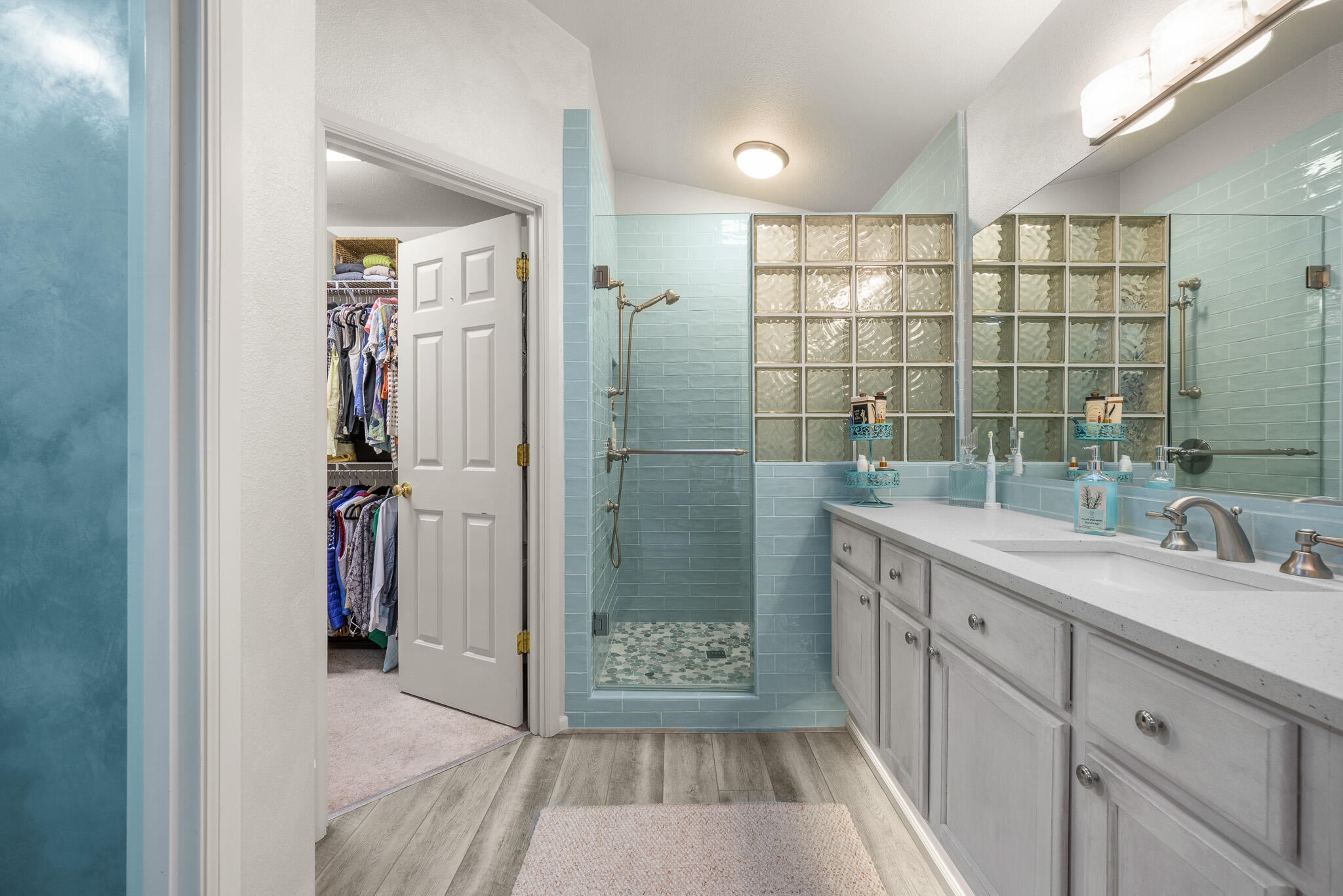 624 Southwest Hill Street Bend, OR 97702 - Photo 24 of 45 a bathroom with a double vanity sink toilet and shower