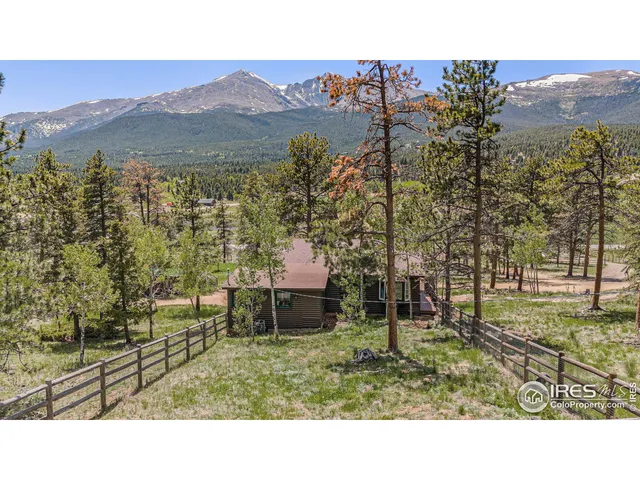a view of a backyard with sitting area