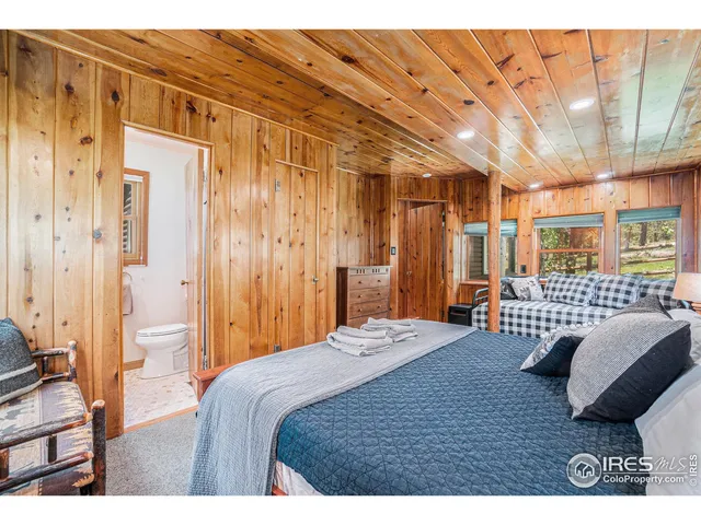 a bedroom with a bed and a walk in closet