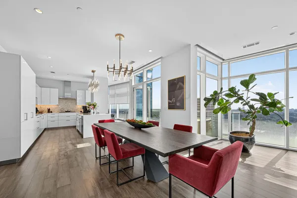 a view of a dining room with furniture and wooden floor