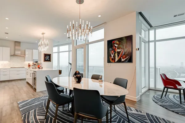 a living room with furniture wooden floor and a rug