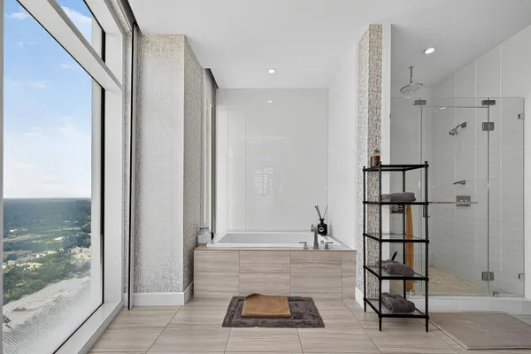a bathroom with a bathtub and shower