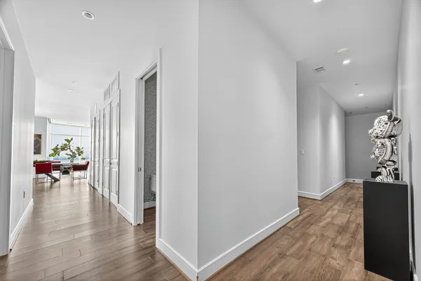 a view of a livingroom with furniture and wooden floor