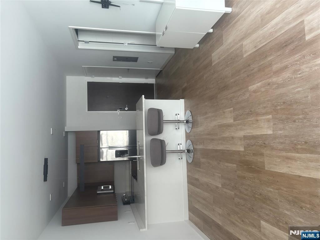 a view of a kitchen with a sink and cabinets