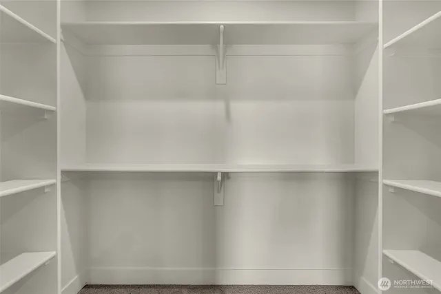 a view of an empty walk in closet