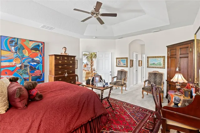 a large white kitchen with a sink and dishwasher a refrigerator with white cabinets
