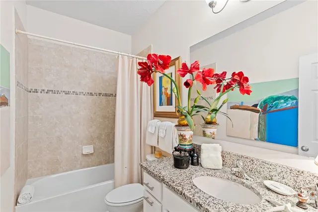 a bedroom with two beds and a window