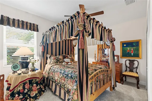 a bathroom with a granite countertop sink mirror toilet and bathtub