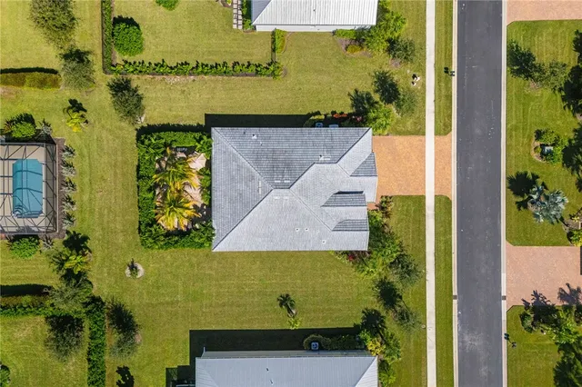 an aerial view of a houses with a lake view