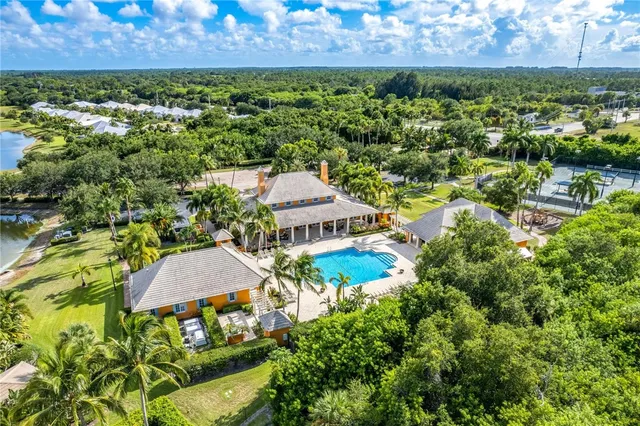 a front view of a house with yard and porch
