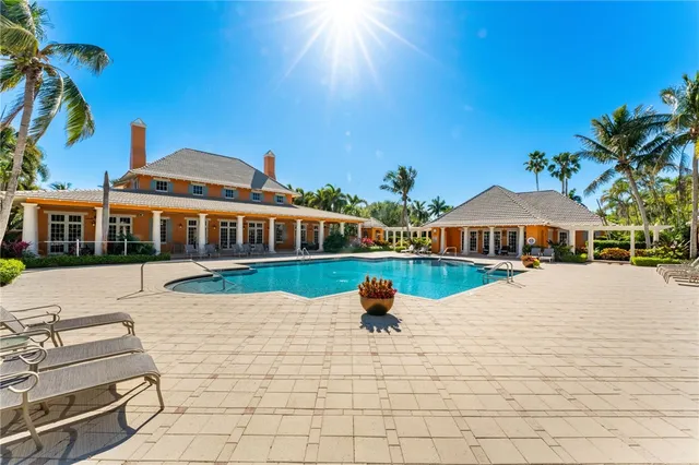 a view of swimming pool with an outdoor seating