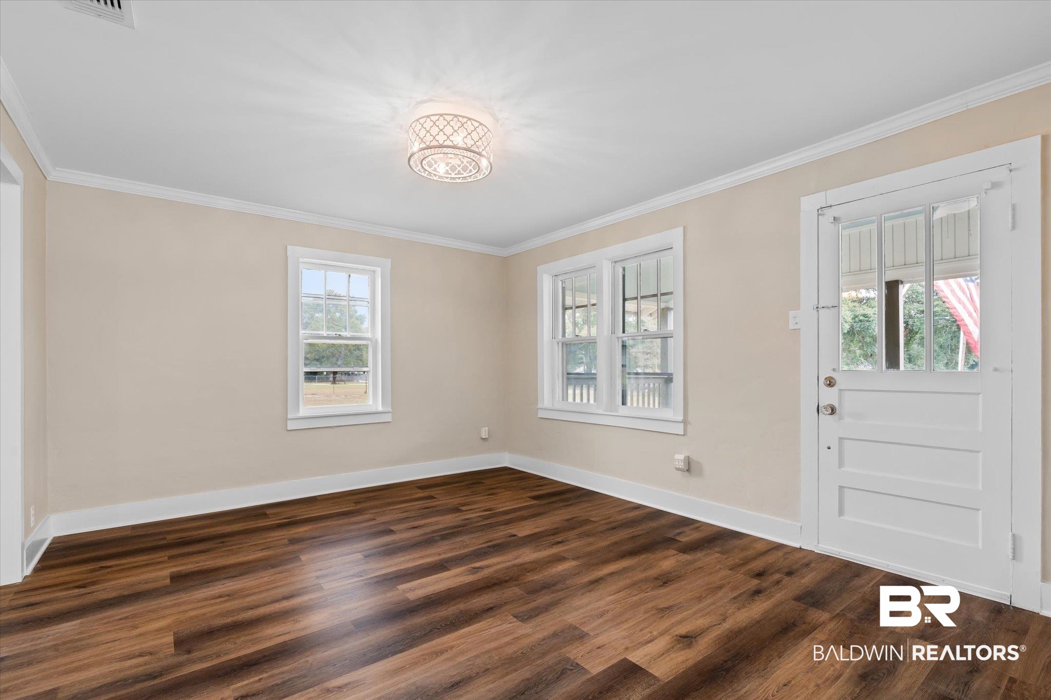 4630 General Road Mobile, AL 36619 - Photo 5 of 33 Entryway featuring dark hardwood / wood-style floors, an inviting chandelier, a wealth of natural light, and ornamental molding