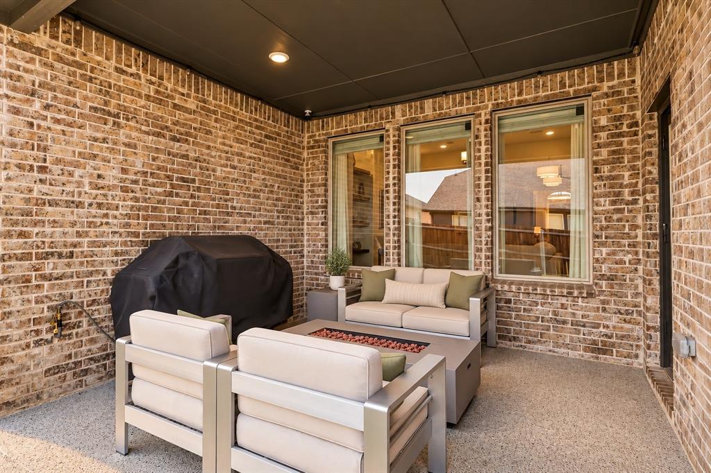 5112 Holy Springs Road Denton, TX 76207 - Photo 19 of 24 Covered Back Patio with epoxy coating, gas stub, permanent Jellyfish perimeter lighting.