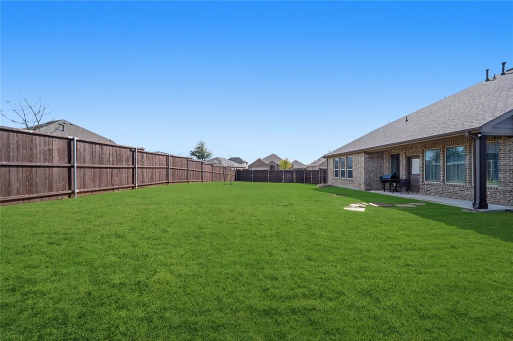 4542 Kipling Avenue Aubrey, TX 76227 - Photo 28 of 34 a view of a house with a big yard and large trees