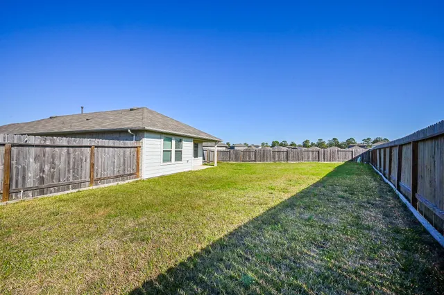 a view of swimming pool with a yard