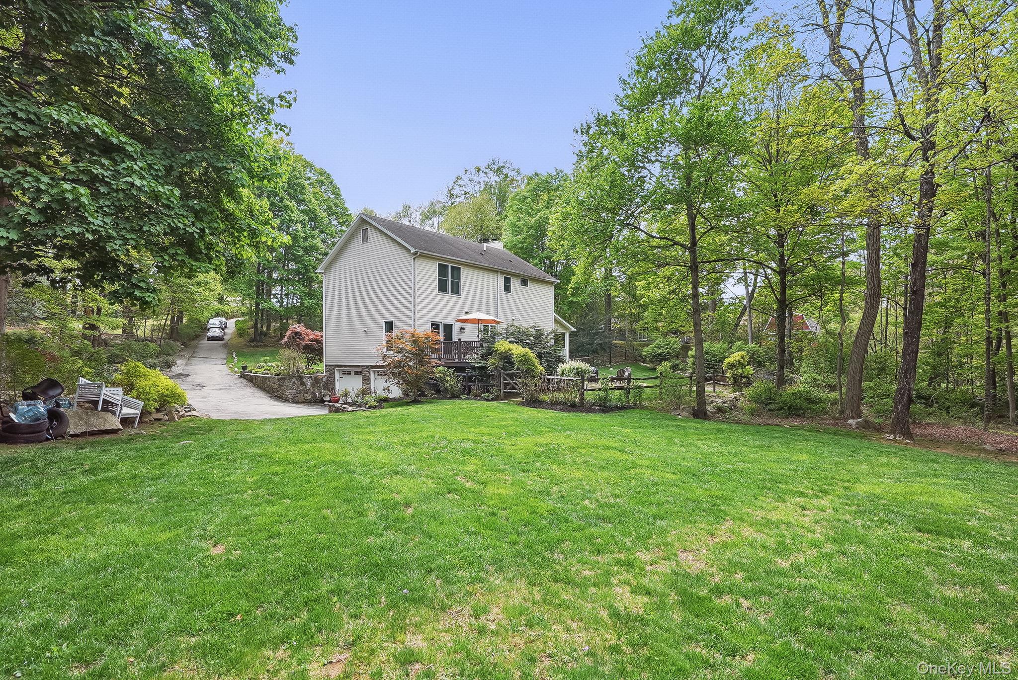 304 Church Road Putnam Valley, NY 10579 - Photo 38 of 50 View of green lawn featuring a garage