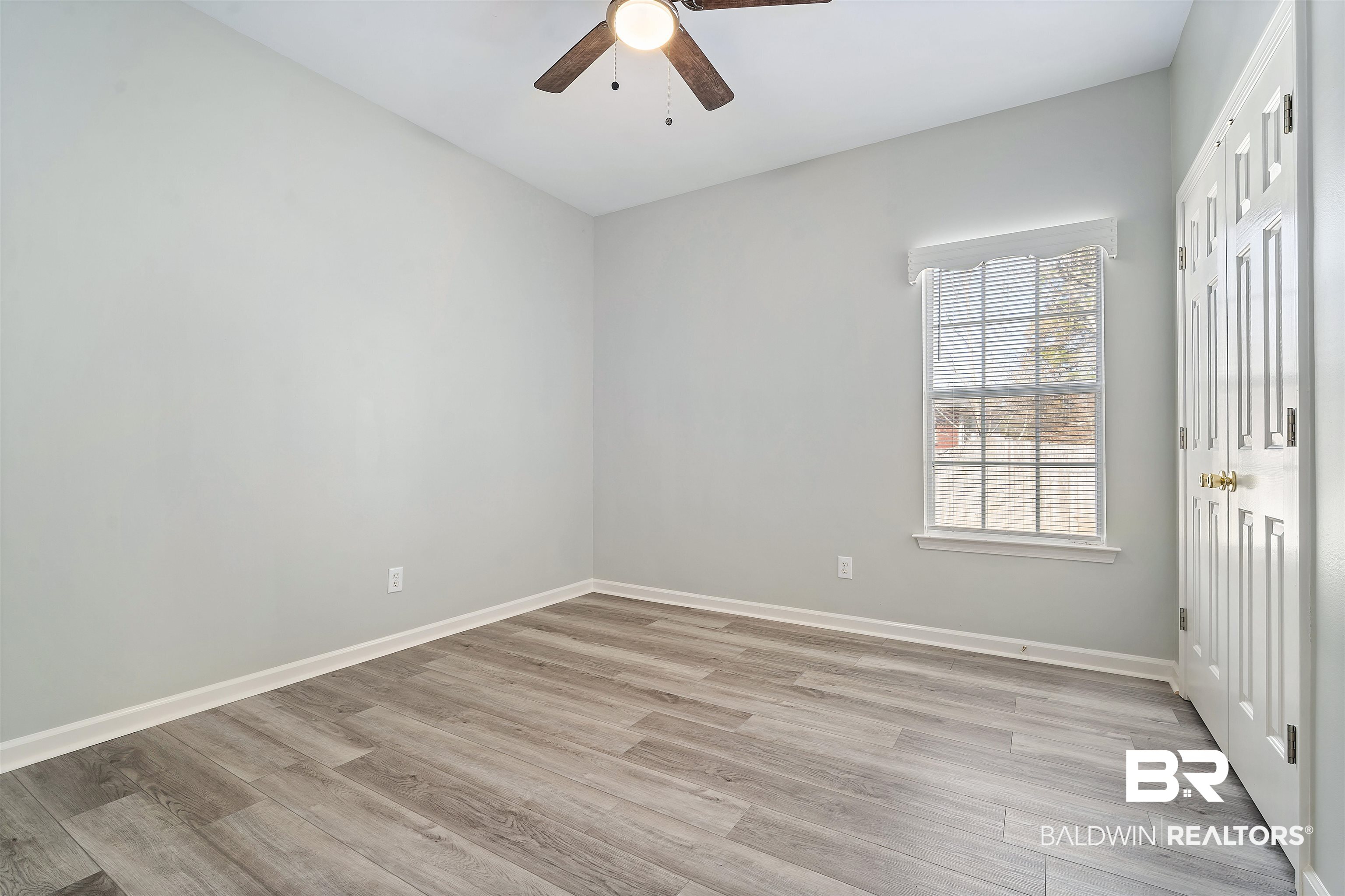 615 Summerlake Place Mobile, AL 36608 - Photo 26 of 35 Spare room featuring light wood-type flooring and a ceiling fan