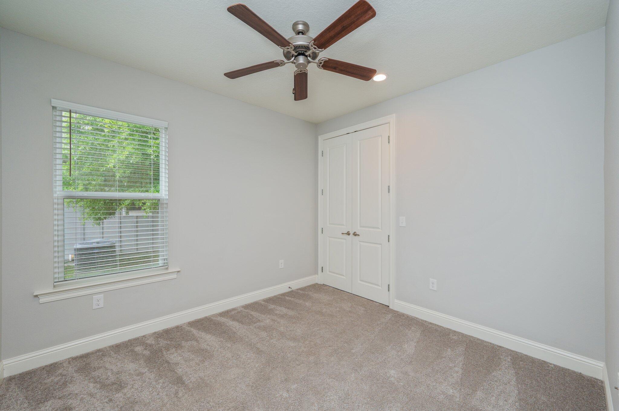 125 Perimeter Place Freeport, FL 32439 - Photo 20 of 26 an empty room with a window and a fan