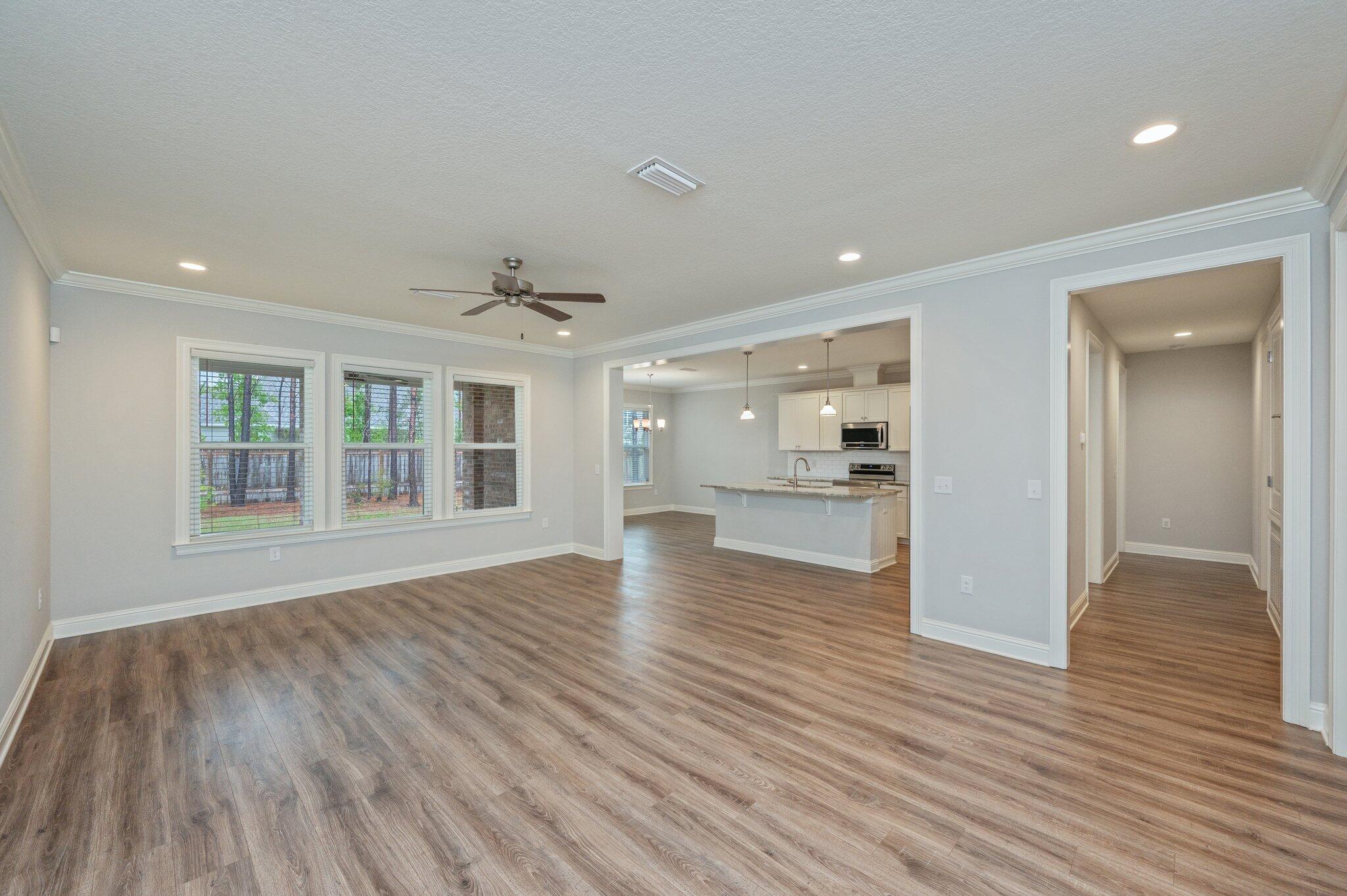 125 Perimeter Place Freeport, FL 32439 - Photo 2 of 26 a view of an empty room and wooden floor