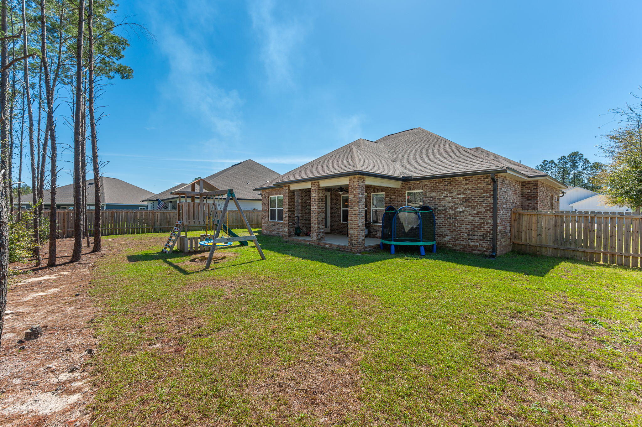 125 Perimeter Place Freeport, FL 32439 - Photo 25 of 26 a view of a house with backyard and a slide