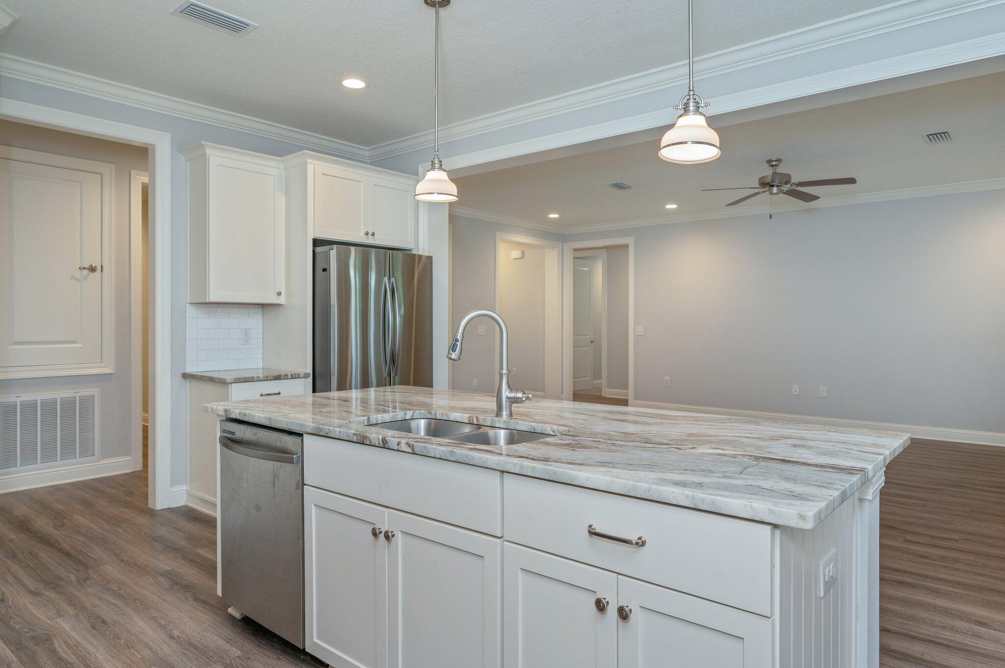 125 Perimeter Place Freeport, FL 32439 - Photo 6 of 26 a bathroom with a granite countertop double vanity sink and mirror