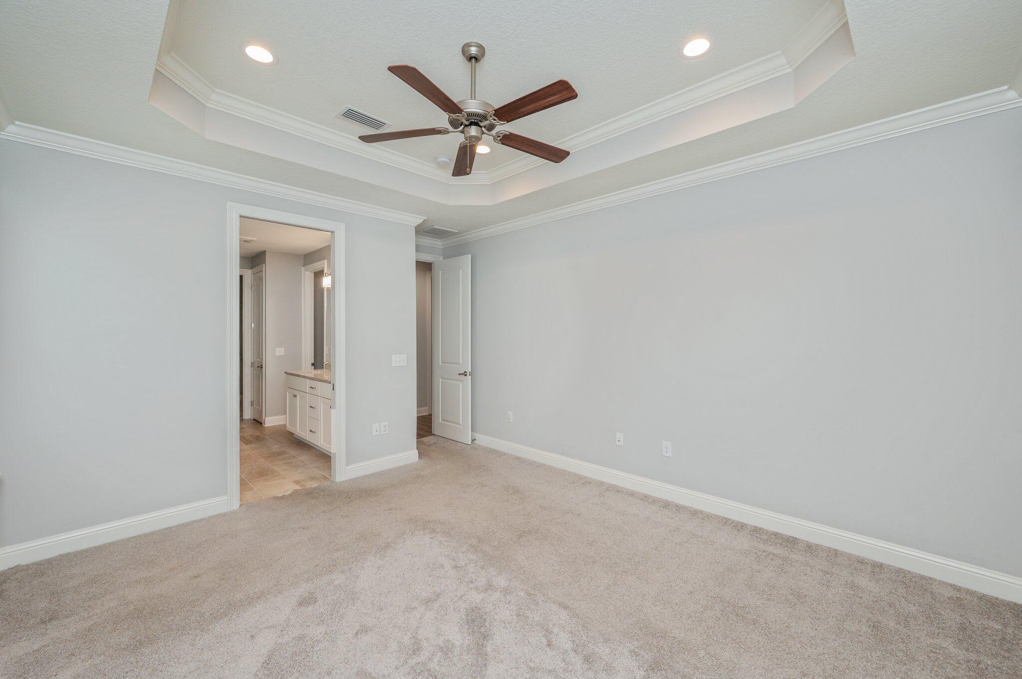 125 Perimeter Place Freeport, FL 32439 - Photo 10 of 26 an empty room with ceiling fan and window