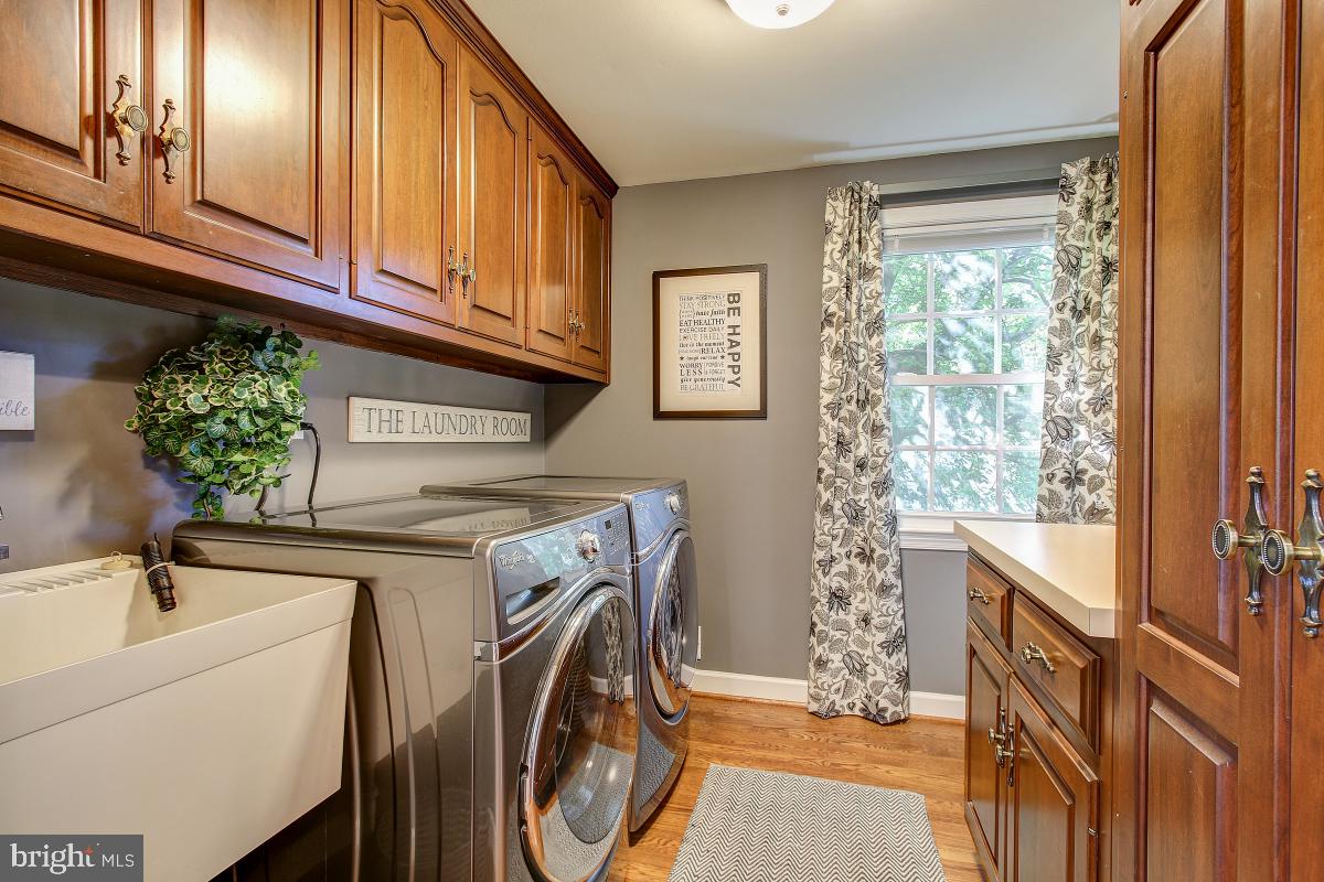9712 Digging Road Montgomery Village, MD 20886 - Photo 18 of 48 Main level laundry with front load washer & dryer