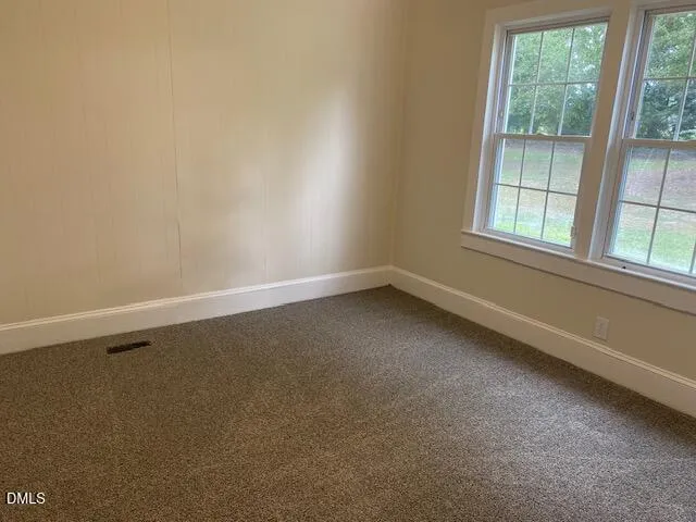 a bathroom with a toilet sink vanity tub and shower