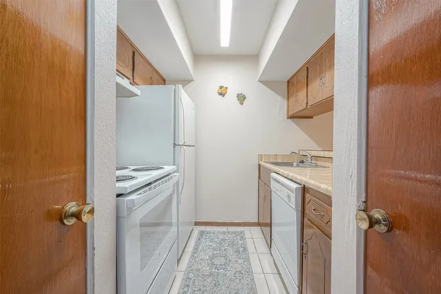 a view of bathroom with a sink and mirror