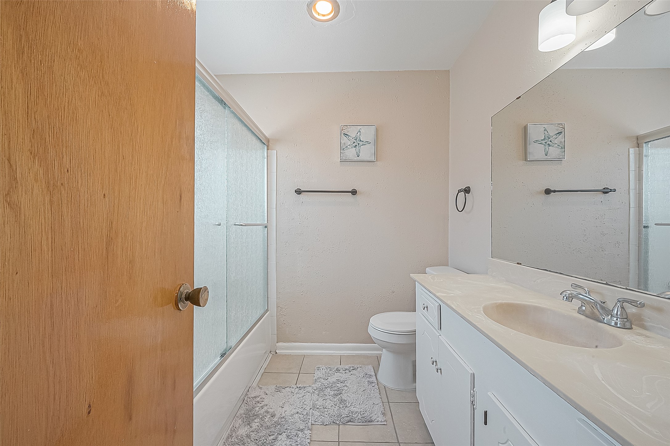 2201 Fountain View Drive, Unit 30 Houston, TX 77057 - Photo 20 of 30 a bathroom with a sink a toilet and shower