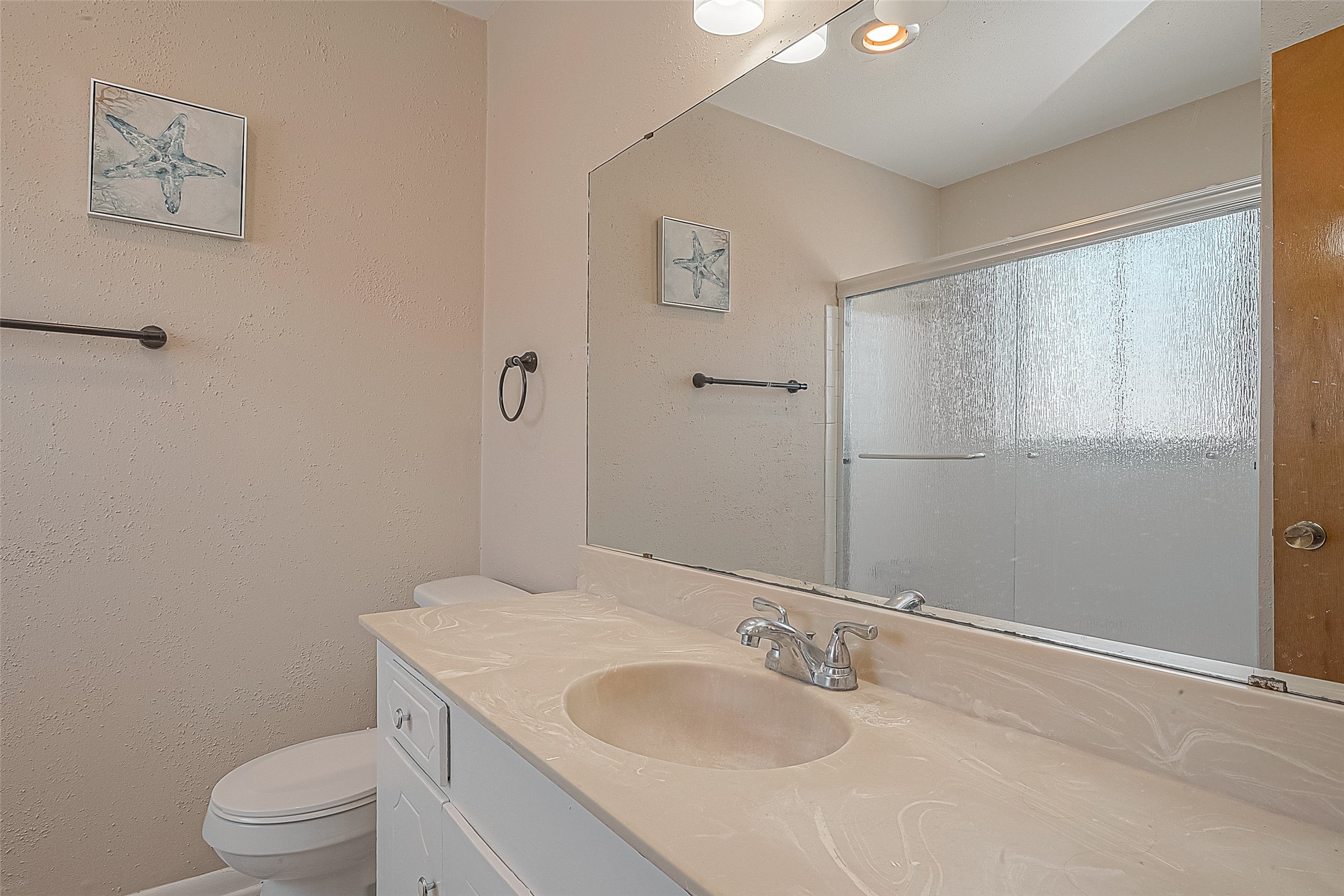 2201 Fountain View Drive, Unit 30 Houston, TX 77057 - Photo 21 of 30 a bathroom with a granite countertop sink toilet and mirror