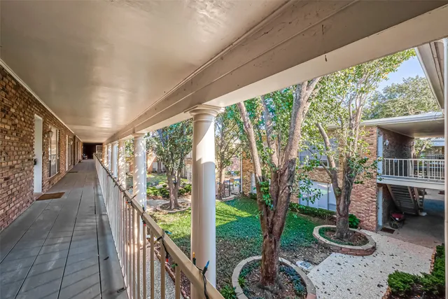 a view of a porch and garden