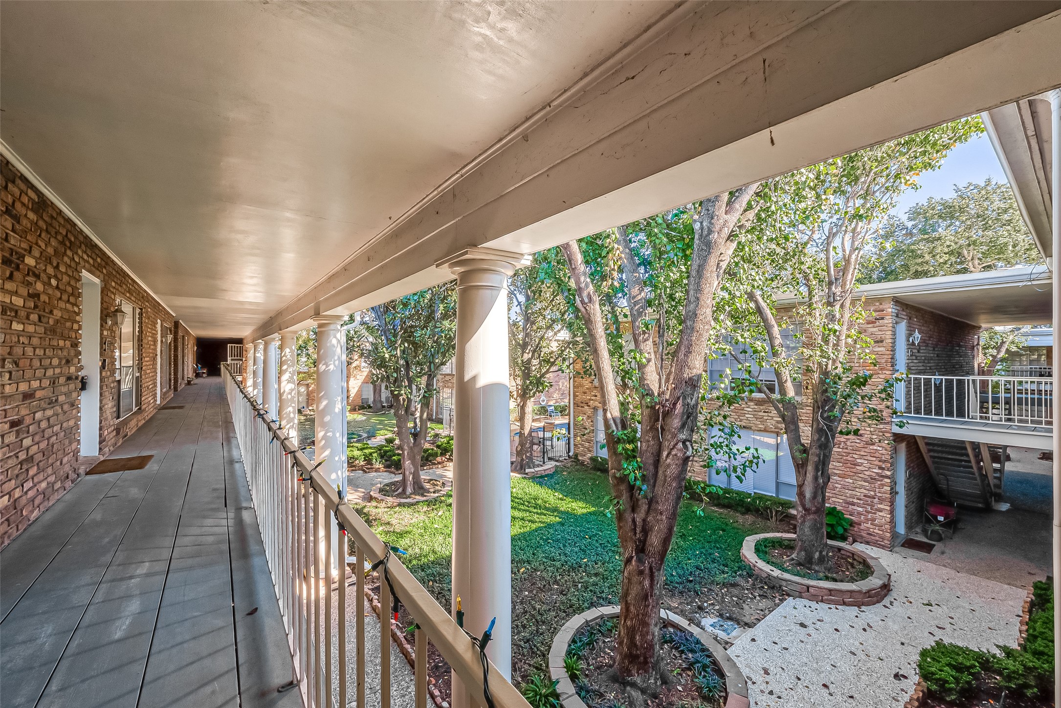 2201 Fountain View Drive, Unit 30 Houston, TX 77057 - Photo 24 of 30 a view of a porch and garden