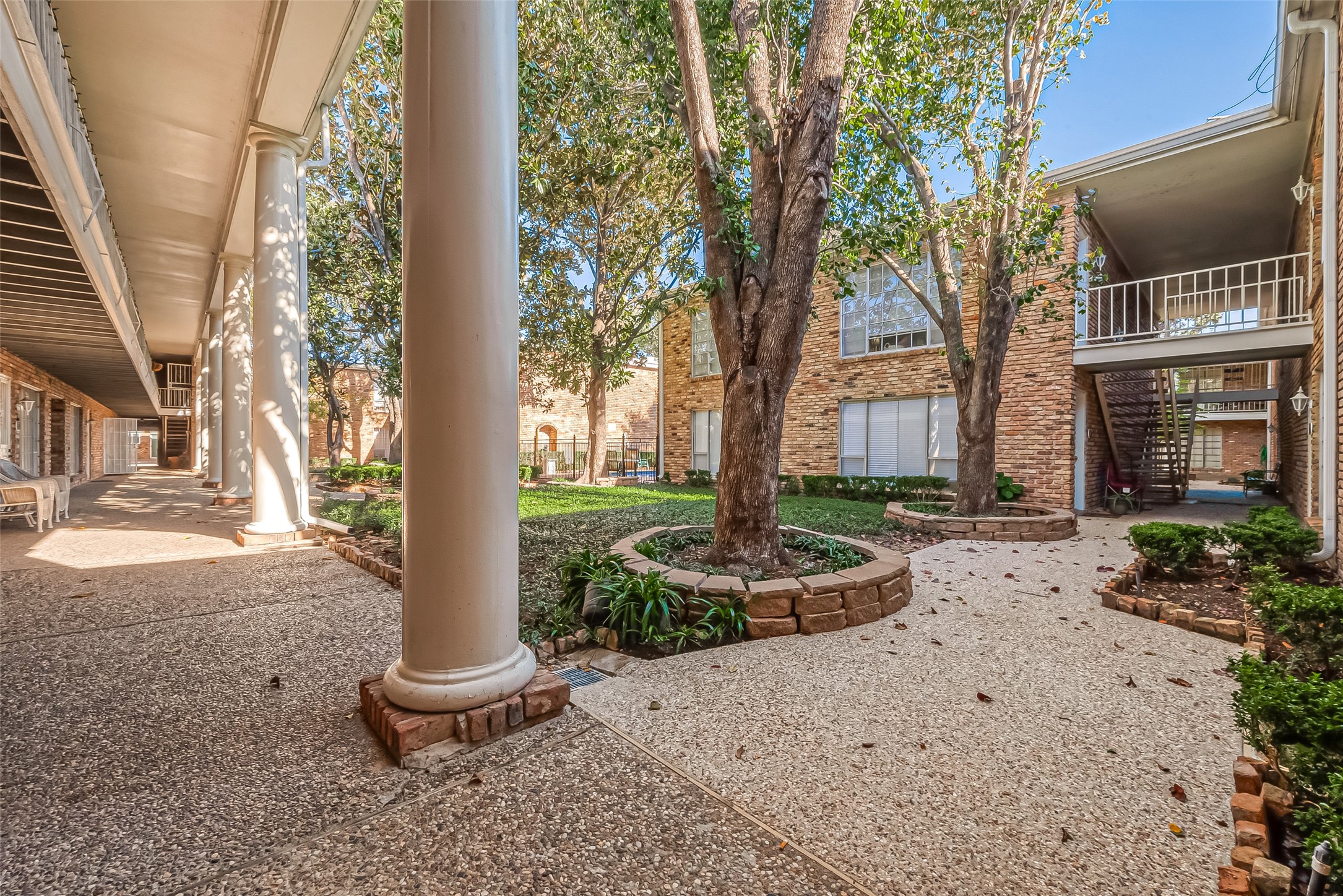 2201 Fountain View Drive, Unit 30 Houston, TX 77057 - Photo 25 of 30 a front view of a house with garden