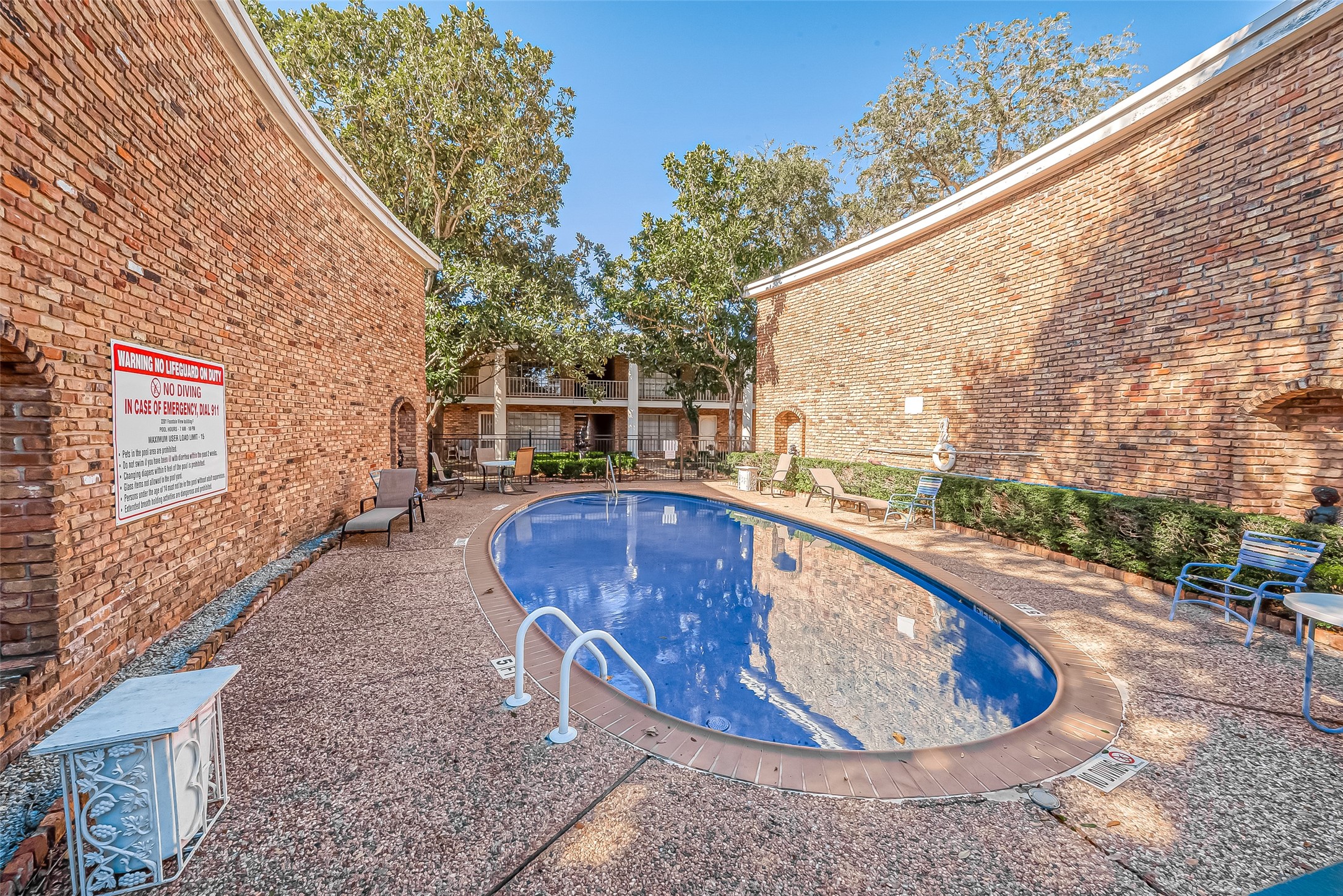 2201 Fountain View Drive, Unit 30 Houston, TX 77057 - Photo 30 of 30 a view of a swimming pool with sitting area
