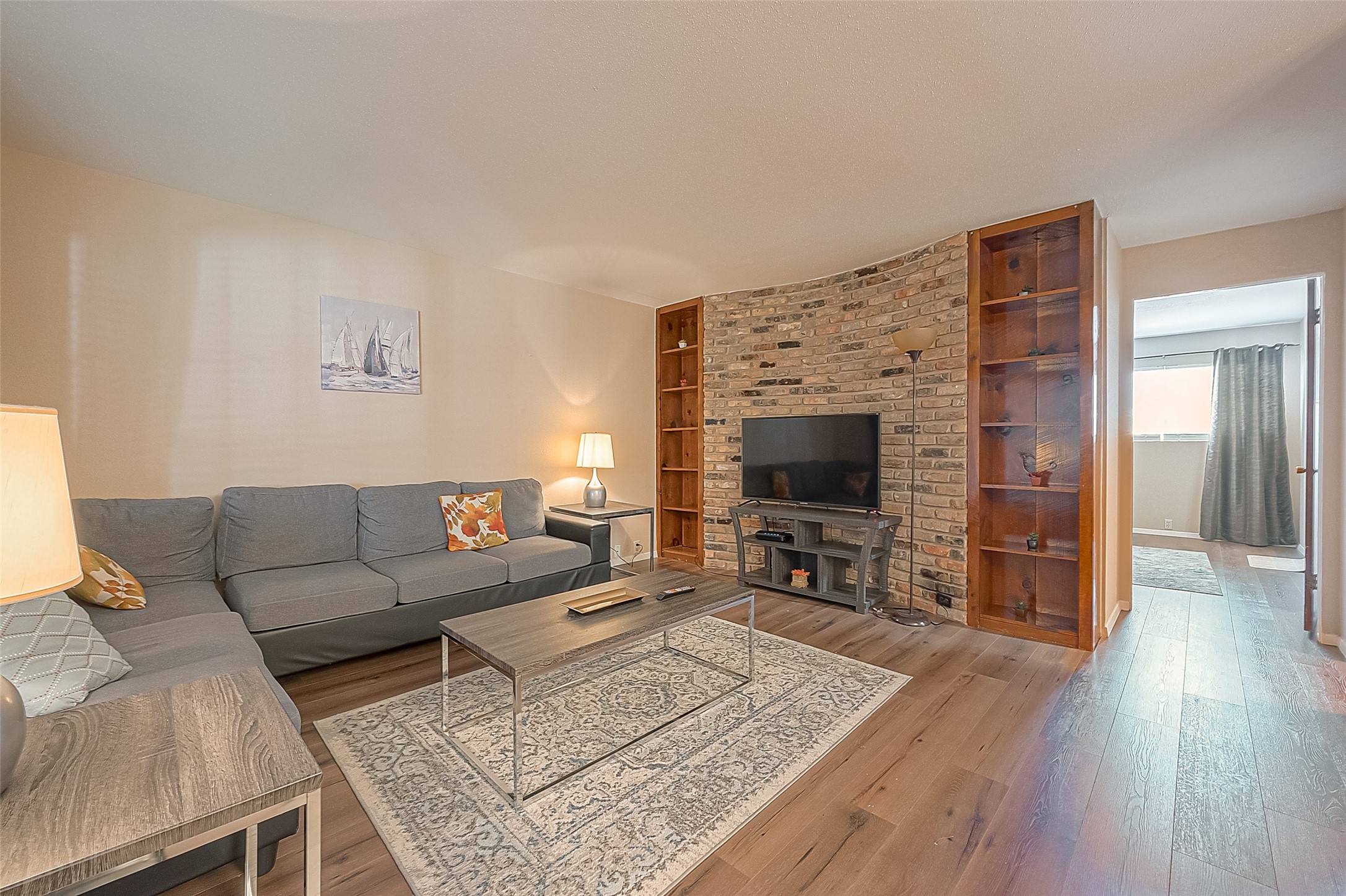 2201 Fountain View Drive, Unit 30 Houston, TX 77057 - Photo 8 of 30 a living room with furniture and a flat screen tv