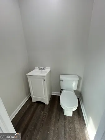 a bathroom with a toilet and a sink